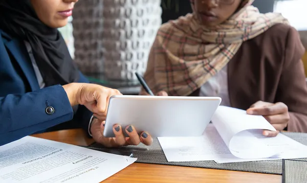 Female professionals working on documents
