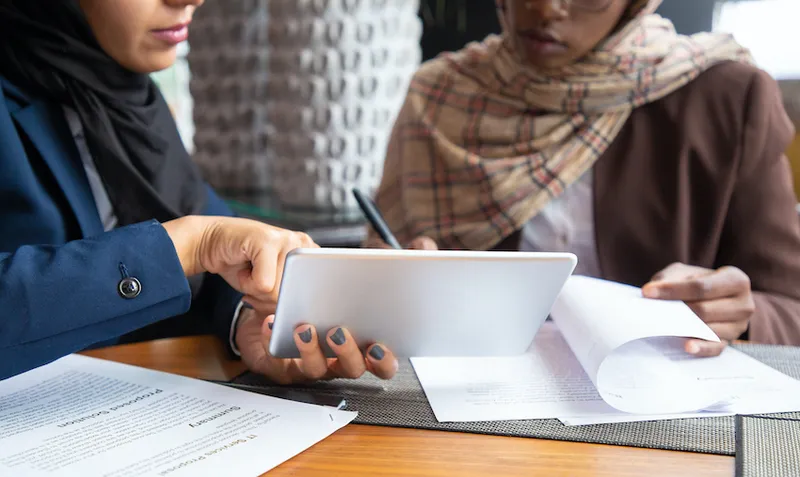 Female professionals working on documents