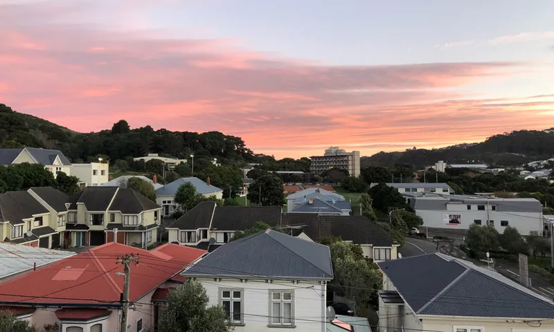 High Angle View Of Townscape Against Sky During Sunset