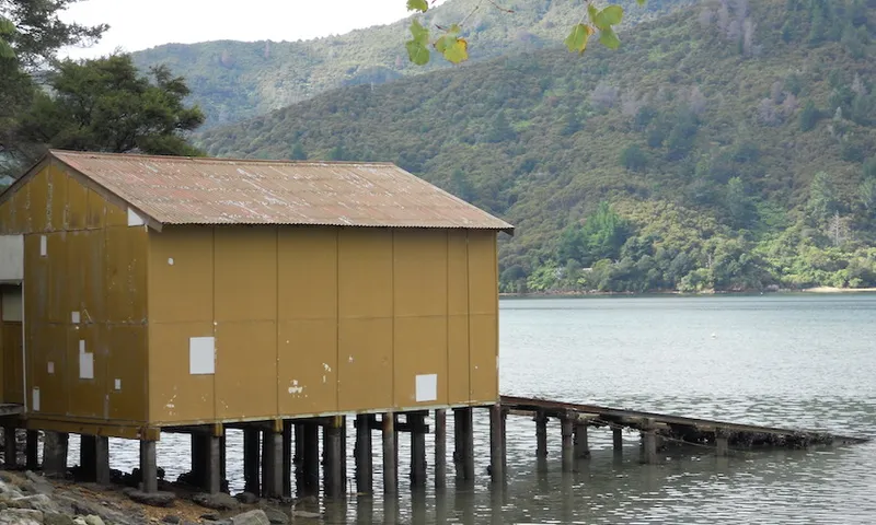 Old Boat Shed Next To Calm Bay