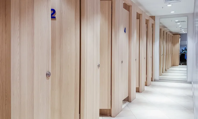 Empty changing rooms with wooden doors in a boutique