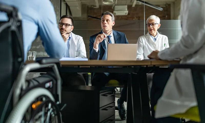 Businessman and medical experts talking to their colleagues in the office.