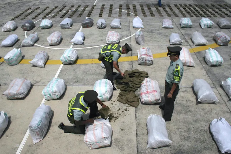 Colombian police officers display packs