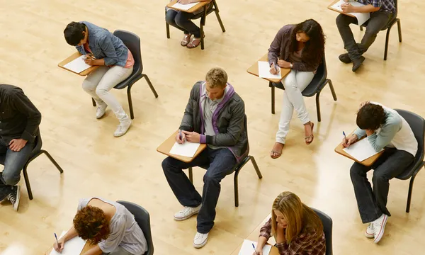 College students taking test in classroom