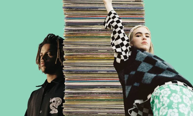 benee and muroki and a stack of records