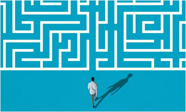 illustration of man walking into maze