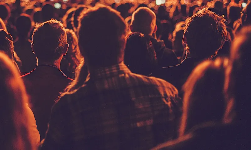 Big concert audience listening to music