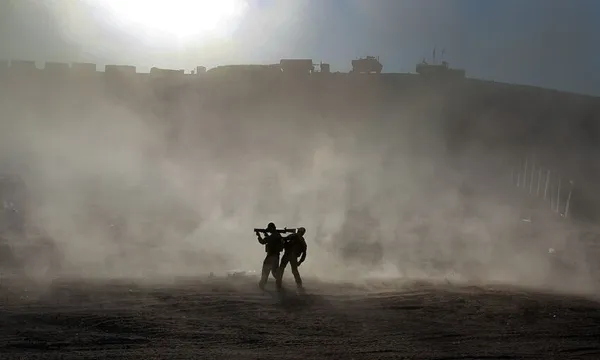 The Australian and Afghan National Army search vehicles at a check point near the patrol base in