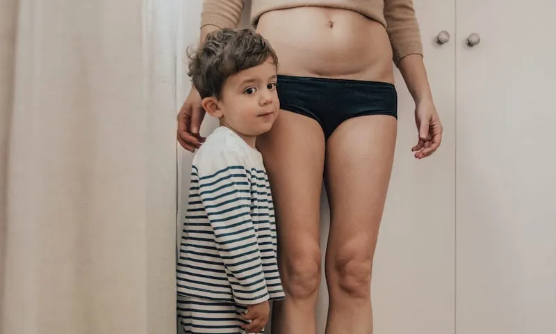 mother with c-section scar and children