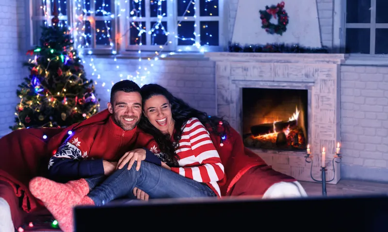Couple watching TV at home