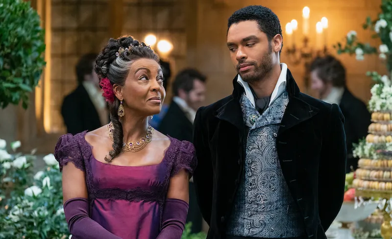 BRIDGERTON (L to R) ADJOA ANDOH as LADY DANBURY and REGÉ-JEAN PAGE as SIMON BASSET in episode 108 of BRIDGERTON Cr. L...