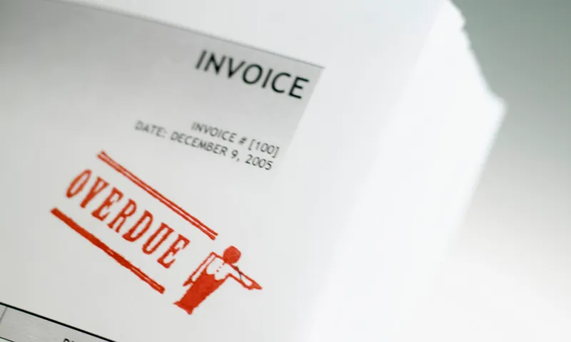 Close-up of overdue stamp on invoice