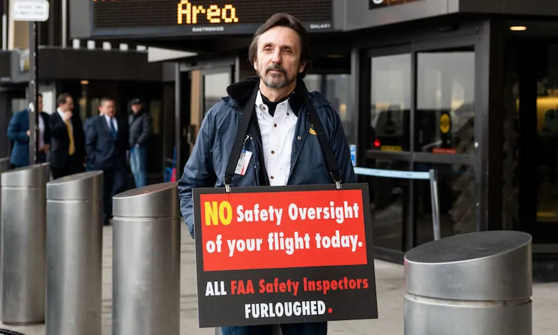 Protester seen outside a press conference in Terminal B at