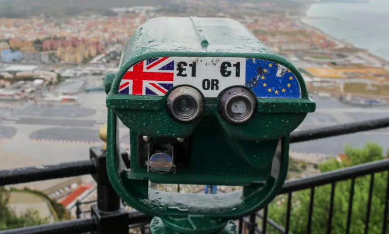 View from Rock of Gibraltar towards Spain with storm clouds and a telescope showing UK and the EU, Gibraltar