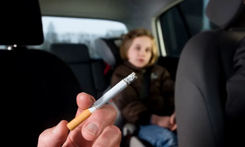 Young Children Suffering The Effects of In Car Passive Smoking
