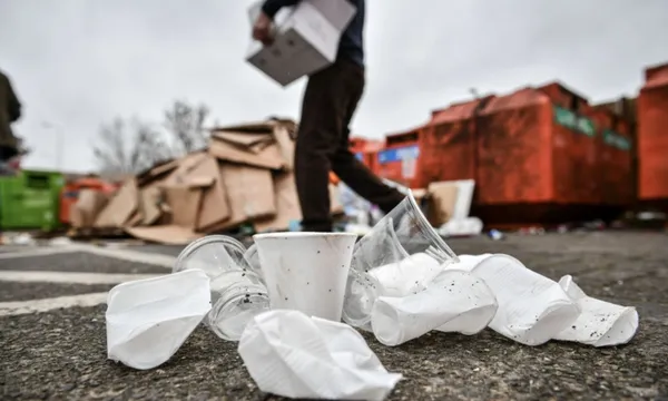disposable plastic cups in front of rubbish bins getty images