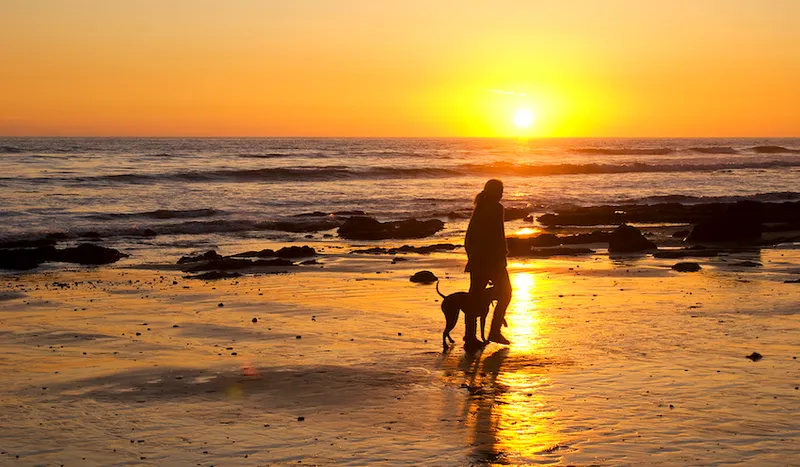 woman on beach at sunset
