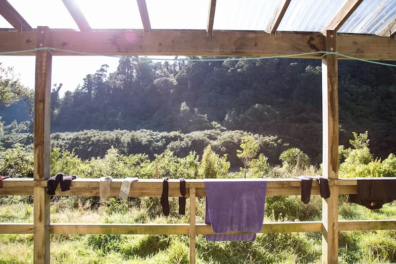 Trampers' dirty washing on the rail outside a tramping hut, Wairarapa