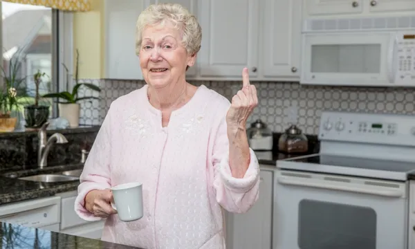 stock photo elderly person doing finger getty