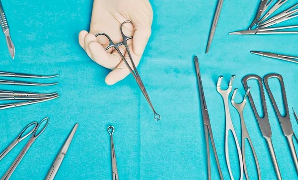 Doctor holding clamp