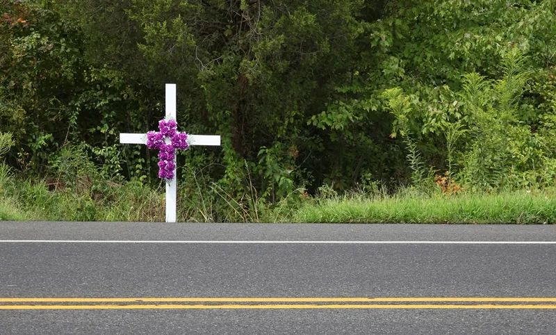 White memorial cross at the roadside