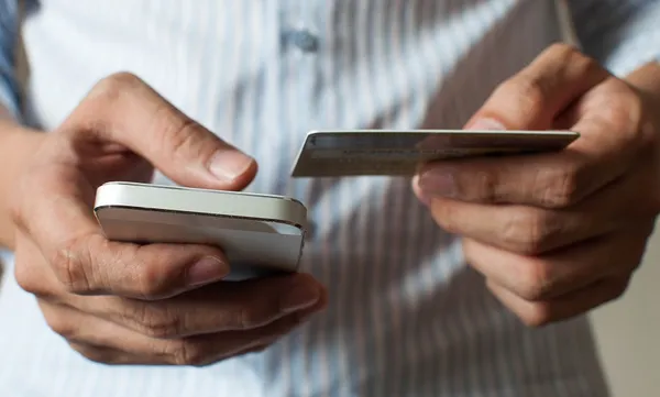 A businessman is buying online