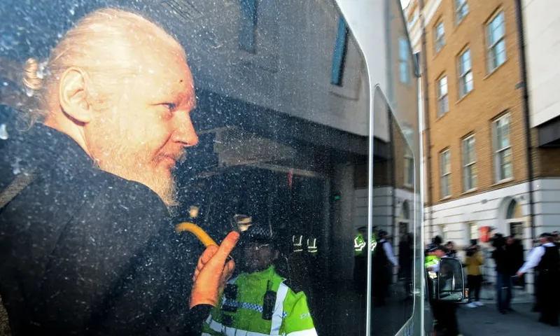 Julian Assange after being arrested in London getty