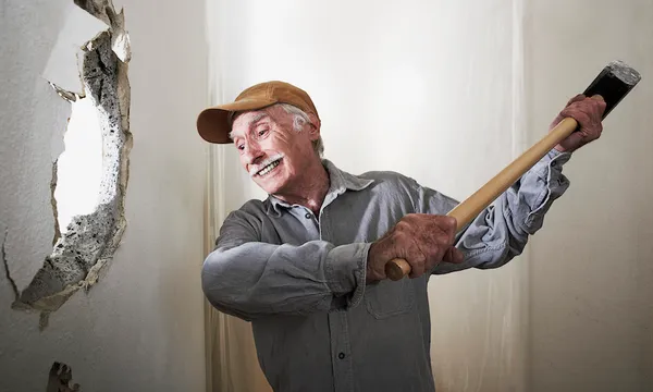 Man using sledgehammer