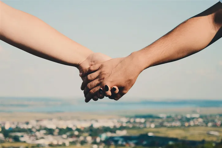 Close-Up Of Man And Woman Holding Hands