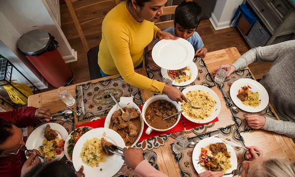 Serving Dinner to her Family