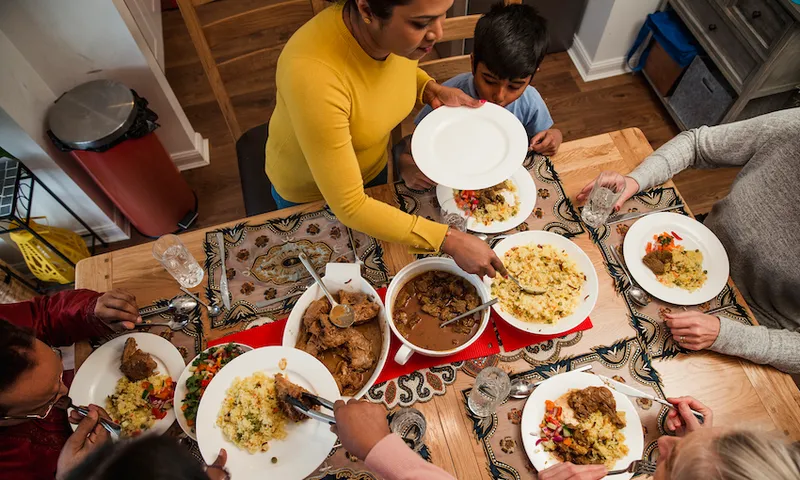 Serving Dinner to her Family