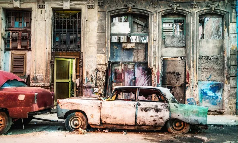 Old damaged vintage Car on the street of old Havana, Cuba