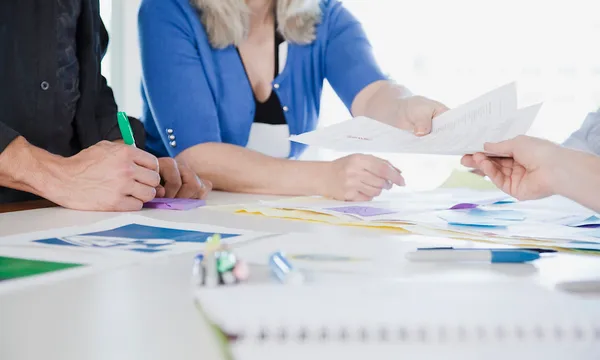 Close-up of people working in office