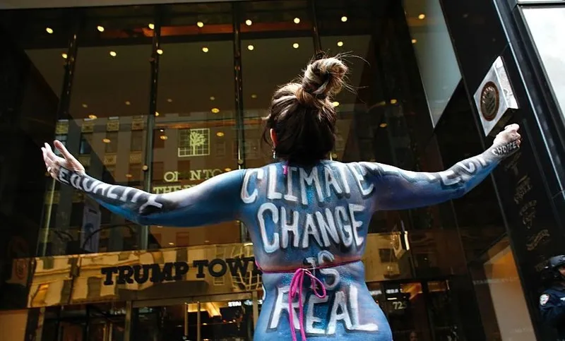 Singer Gigi love protests against climate change outside the Trump Tower in New York on November 14, 2016. / AFP / KENA BETANCUR (Photo credit should read KENA BETANCUR/AFP/Getty Images)