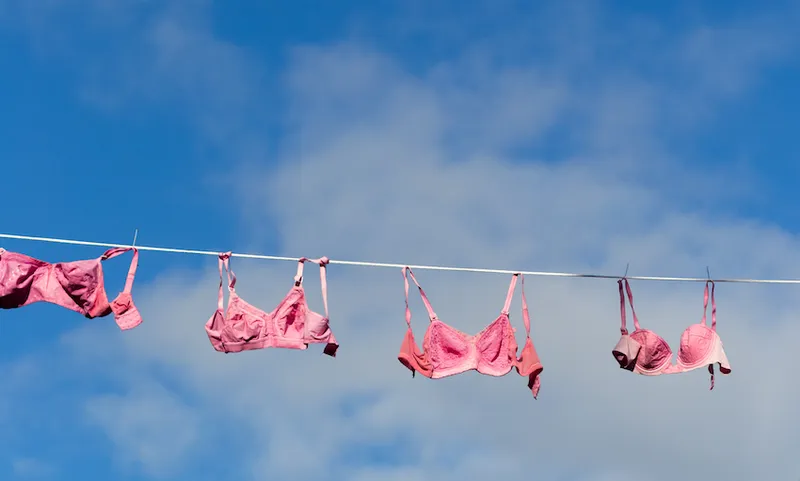 Low Angle View Of Bras Hanging On Clothesline Against Sky