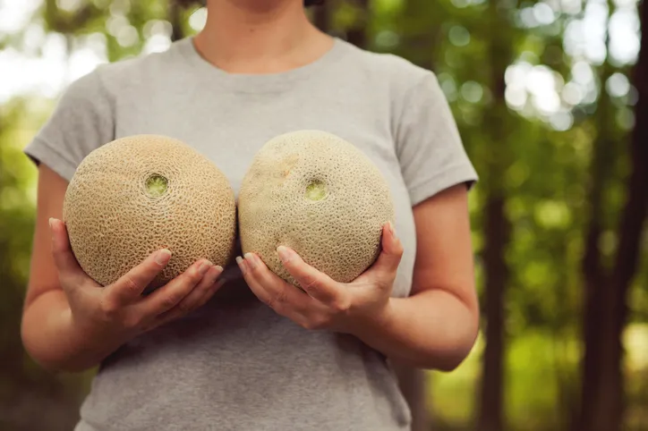 Woman Holding Melons