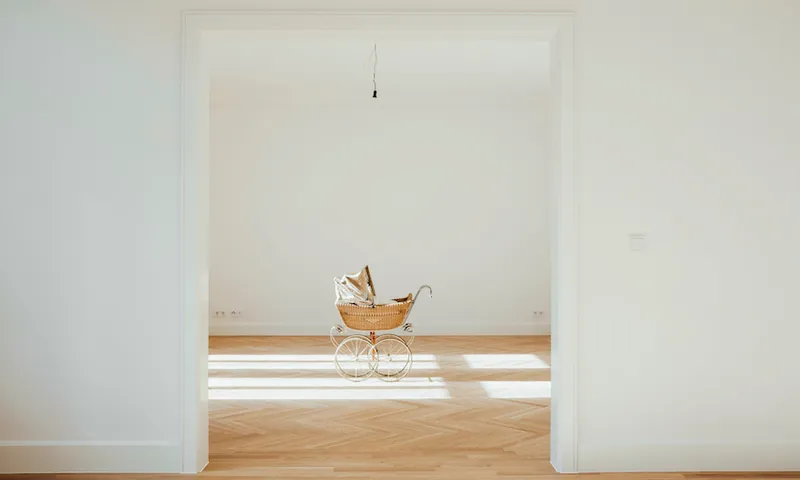 Pram in empty room, open doors