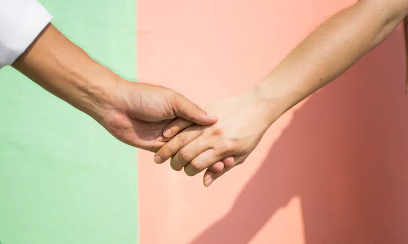Cropped Hand Against Wall