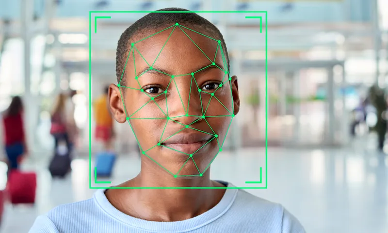 Face recognition markings on the face of a short-haired young woman.