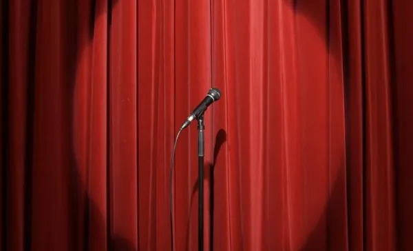 Spotlight on microphone stand on stage