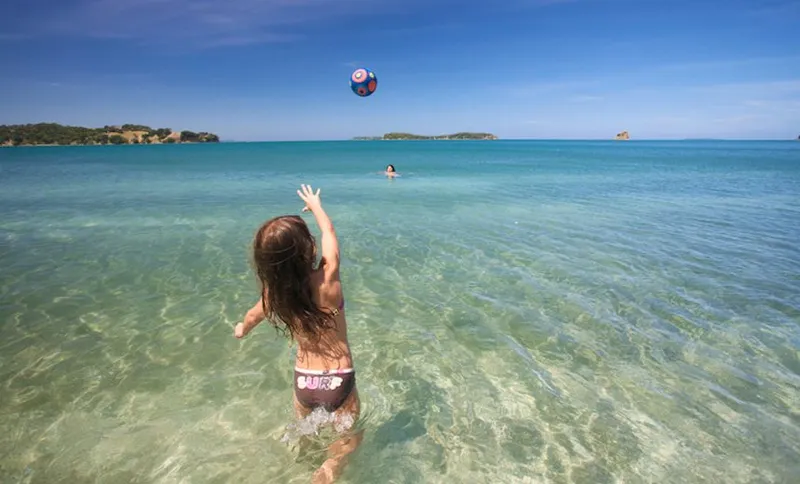 Girl playing  with beach ball