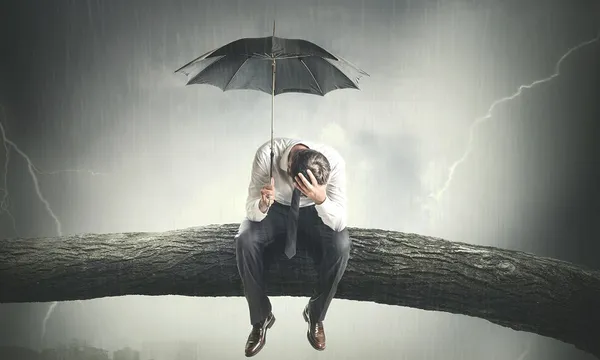 desperate man crying under rain