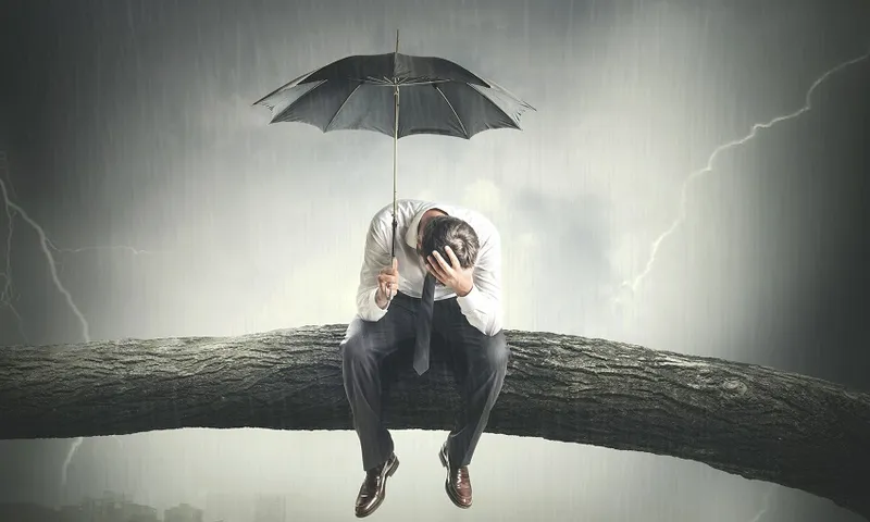 desperate man crying under rain