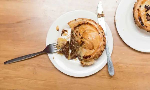 a delicious beef and blue cheese pie with golden pastry and oozing filling