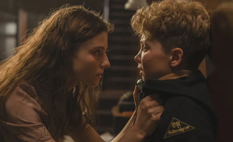 Thomasin McKenzie and Roman Griffin Davis in the film JOJO RABBIT. Photo by Kimberley French. © 2019 Twentieth Centur...