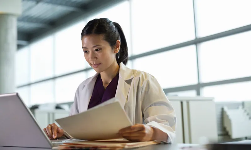 Medical professional using laptop