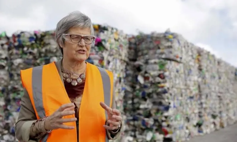 environment minister eugenie sage in front of rubbish pile rnz Ana Tovey
