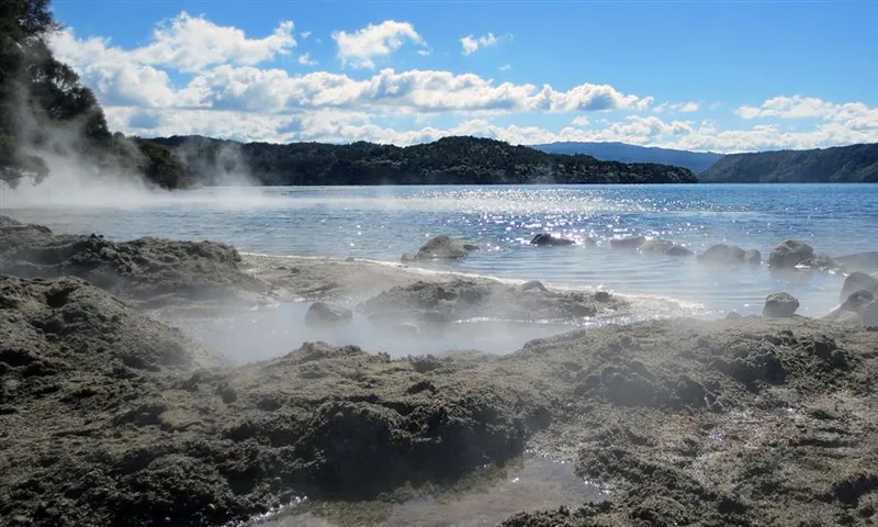 steam rises out of beach puddles dug out of the sand
