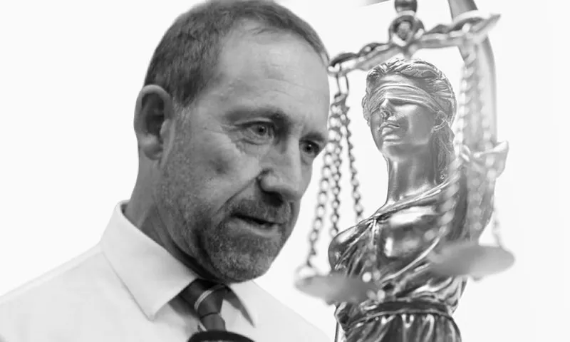 Close-Up Of Lady Justice Against White Background