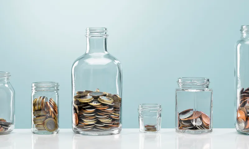 Coins in variety of glass bottles